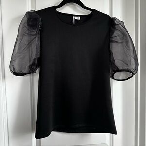 “Little Black Top”. Dress up with a skirt or down with jeans.